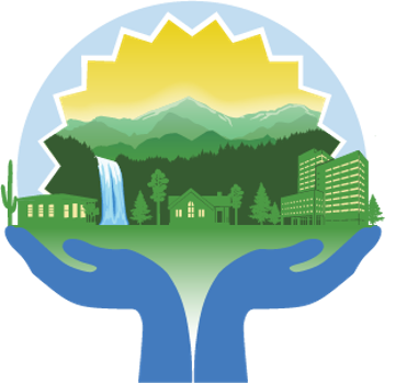 Blue hands holding a green cityscape