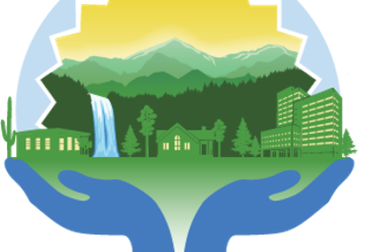 Blue hands holding a green cityscape